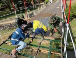Satgas Gulbencal Kodam I/BB Rampungkan Perehaban Jembatan Gantung Penghubung Desa Ladang Tengah, Kecamatan Andam Dewi